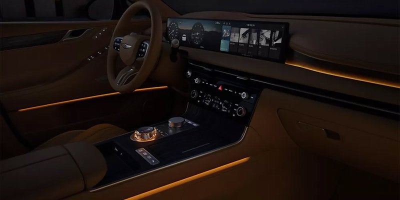 Luxury sedan interior featuring a wide digital display that spans the instrument cluster