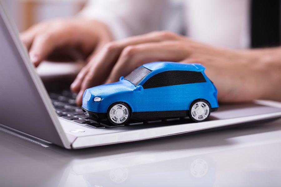 Online vehicle shopping on laptop